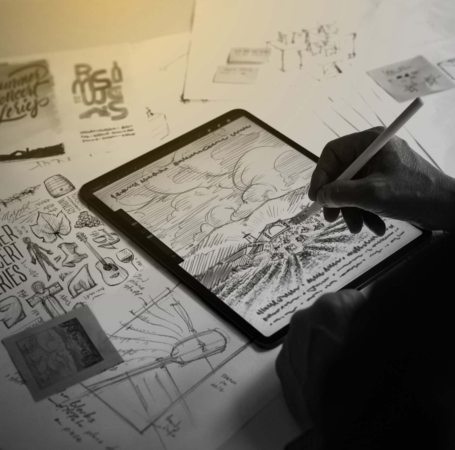 Photograph of someone sketching out ideas for a winery advertisement.